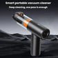 Handheld car vacuum cleaner with orange filter, shown upright with wide nozzle