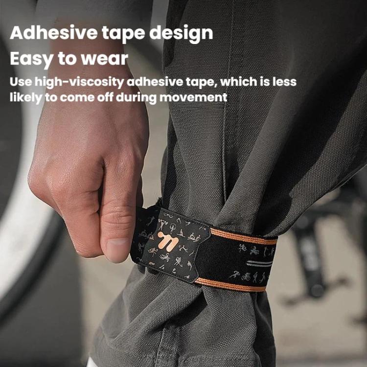 Reflective cycling pant strap band with adhesive-style panel, black band on gray pants