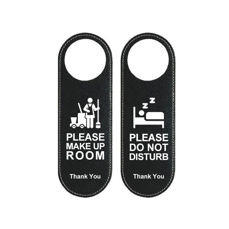 Reversible black leather hotel door hanger sign, “Please Make Up Room” and “Do Not Disturb”.