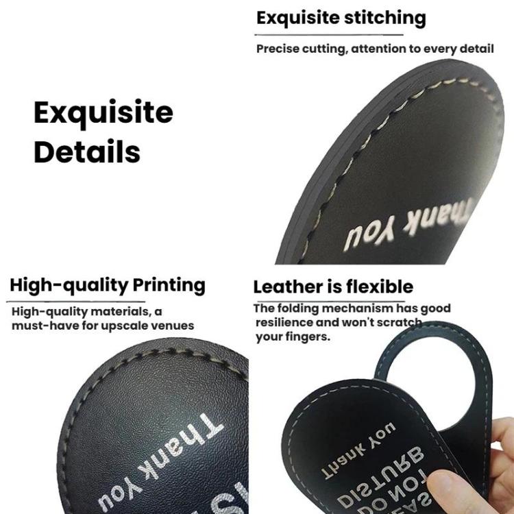 Close-up of black leather hotel door hanger sign with white stitching and printed text.