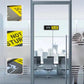Sliding office sign on glass door with DO NOT DISTURB message and yellow panel