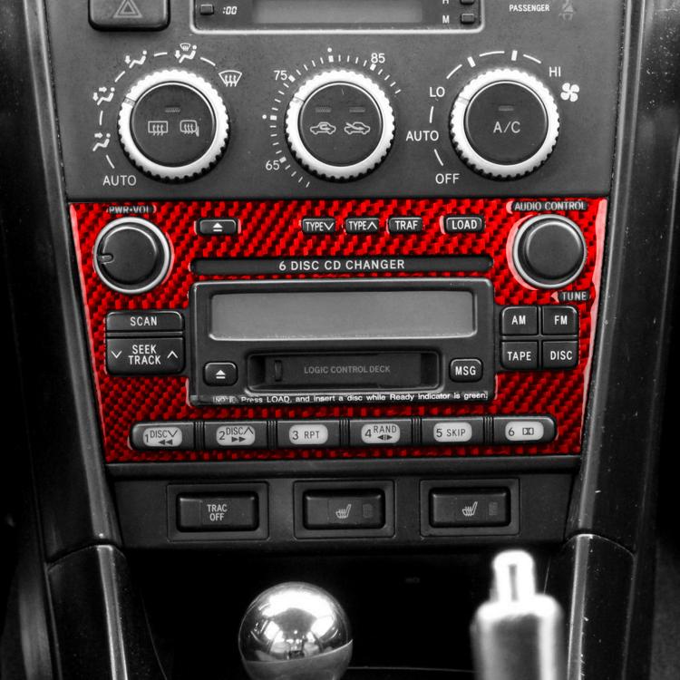 Red carbon-fiber style radio panel trim sticker on car audio center with knob cutouts