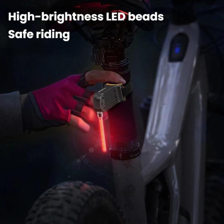 Bicycle tail light emitting a red vertical LED strip from a black shark housing