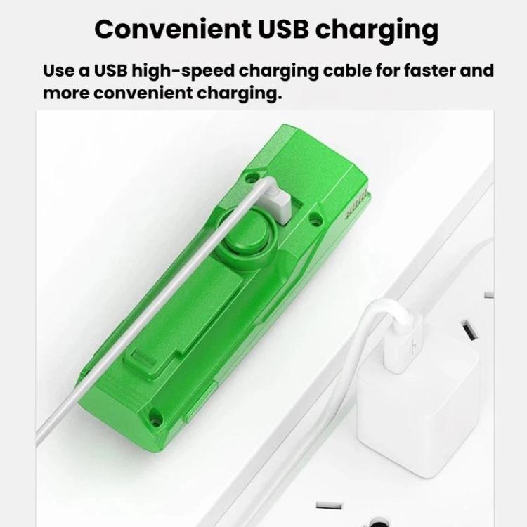 Green bike headlight with USB charging cable, charging port and power button detail