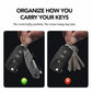 Black key organizer clip with key fob and car keys, held in a hand