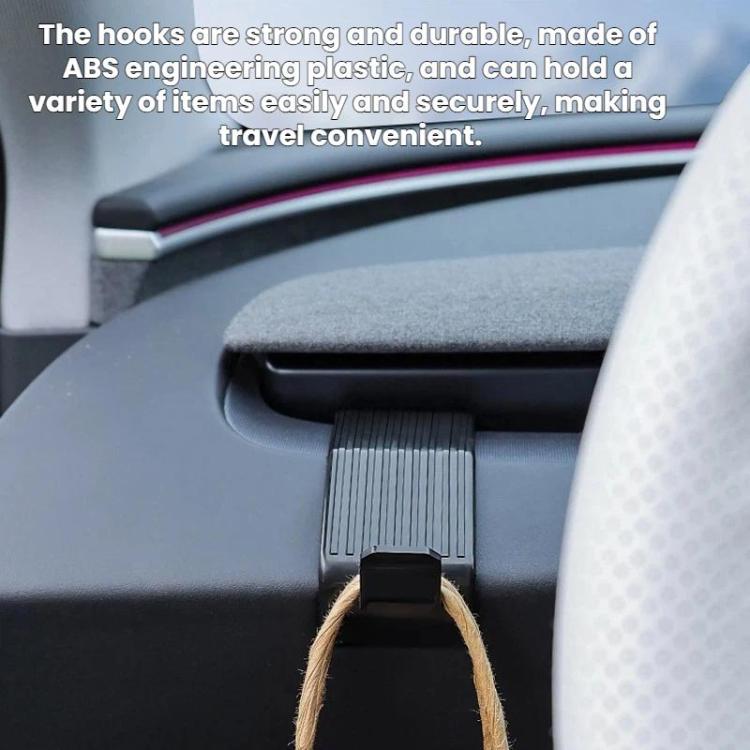 Black dashboard hook with a hanging strap on the car seat console
