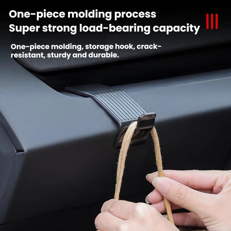 Dashboard storage hook holding twine or strap, attached to the console side