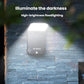 Solar motion sensor garden wall light mounted on a stone wall, glowing white