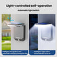 Solar motion sensor garden wall light with bright white LED illumination on panel