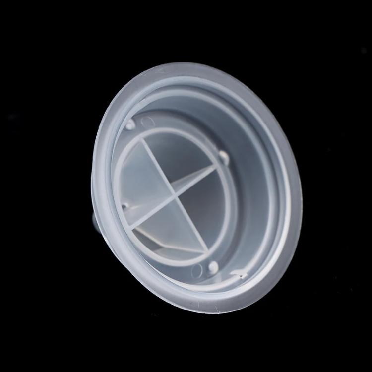 Clear plastic cleaning cup insert with X-shaped support and small vents