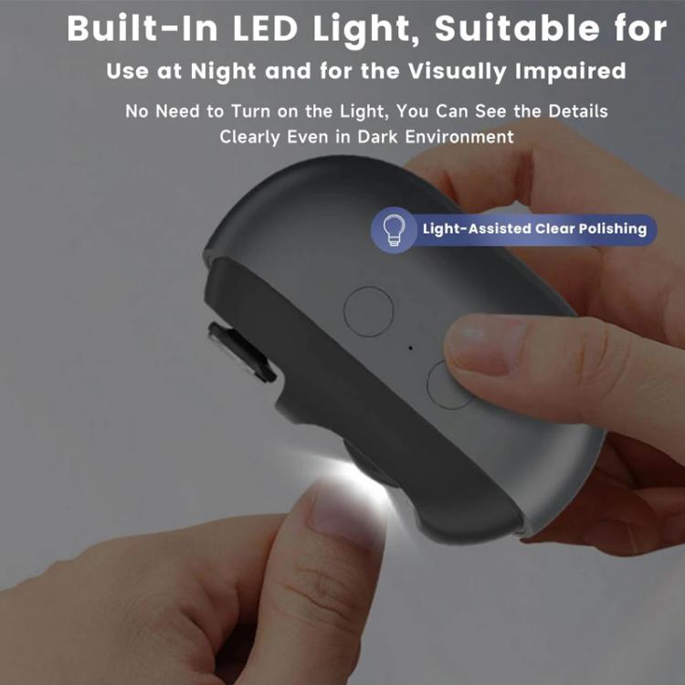 Hand holding gray electric nail clipper with flip cover and polishing head
