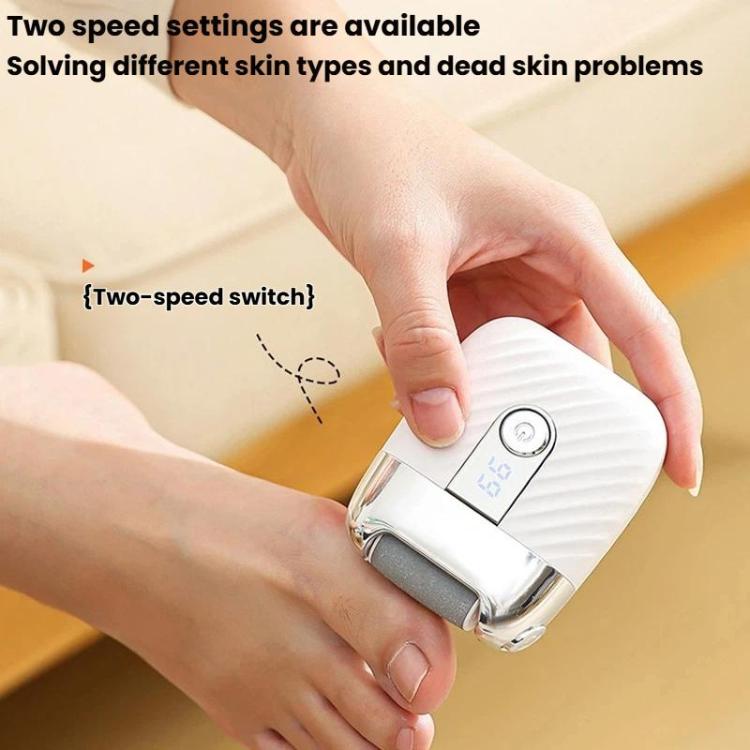 Rechargeable electric foot file with LED display held against a foot for grinding