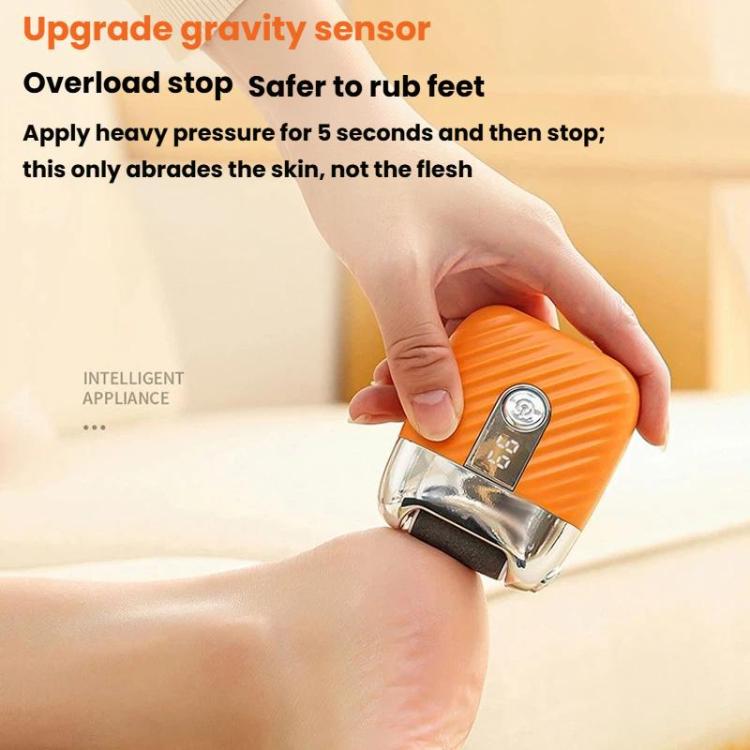 Orange electric foot file with safety sensor and power button, held in hand