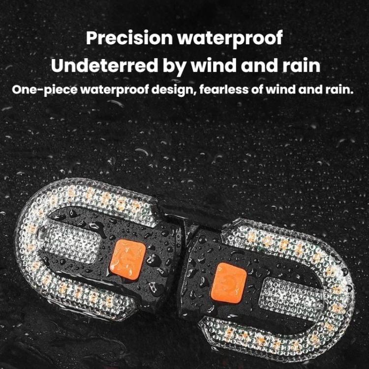Black waterproof bike turn signal taillight with clear LED perimeter and orange inserts