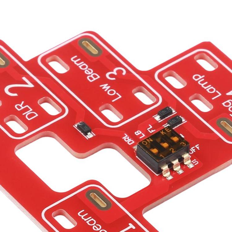 Red circuit board close-up with microchip and small electronic components
