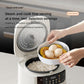 White electric rice cooker with lid open, black inner pot, and egg steaming basket