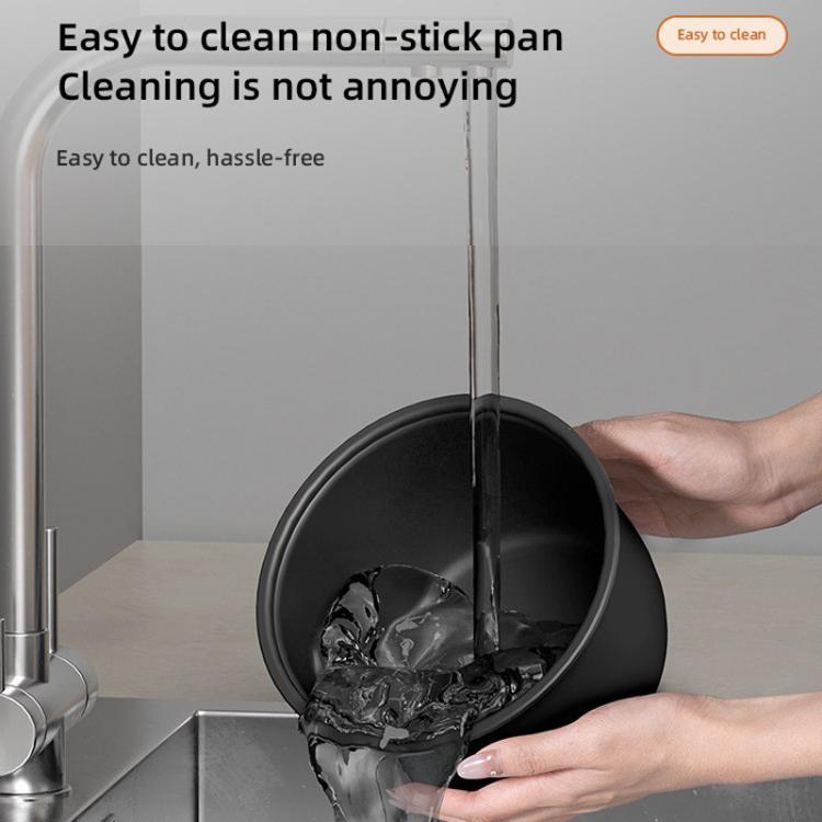 Rinsing inner pot of electric rice cooker, hands showing nonstick interior