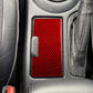 Red carbon-fiber cup holder panel sticker installed on center console