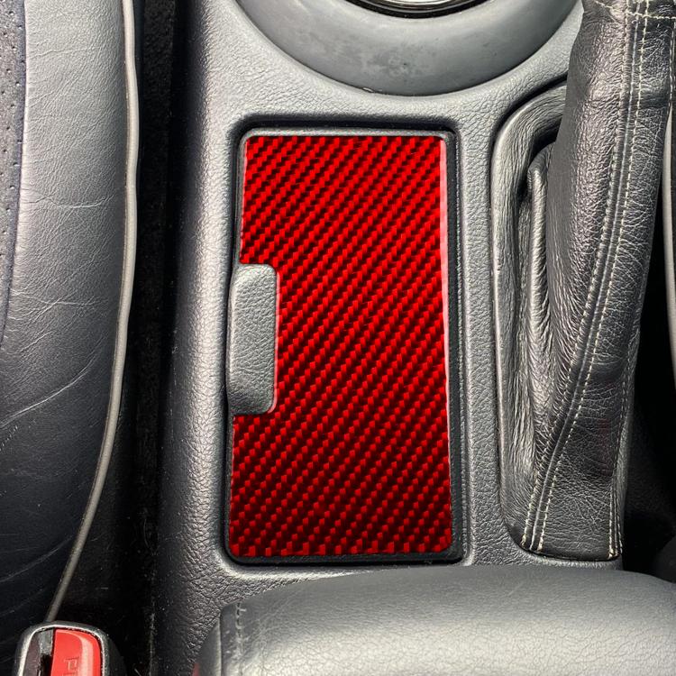 Red carbon-fiber cup holder panel sticker installed on center console