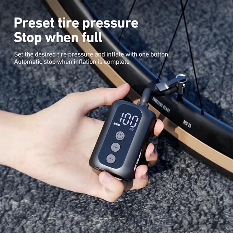 Electric air pump controller held in hand with digital pressure readout