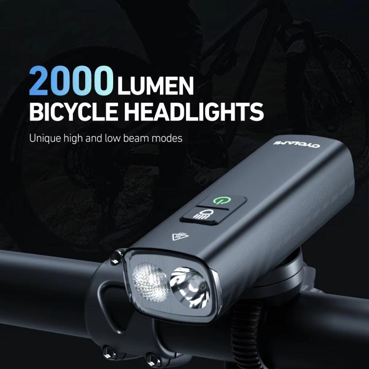 Rechargeable bike headlight mounted on handlebar with dual light lens front view