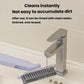 Lavender spray brush rinsing and brushing a drain area with gray bristles