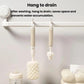Hanging bottle brush set with straight handles and sponge heads for draining.