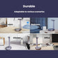Portable automatic water dispenser pump, grey, shown dispensing on countertop