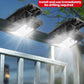 Two black solar clip-on fence lights shining under a railing