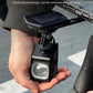 Bicycle front light with quick-release mount, held in hand for attaching