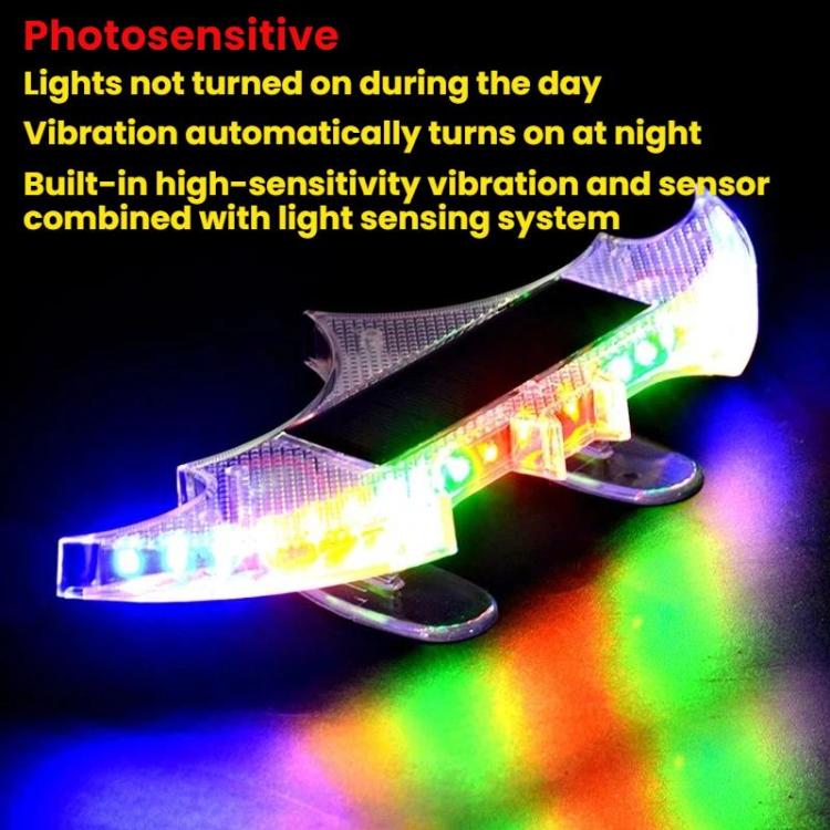 Solar-powered rear wing light flashing LEDs in multicolor; bat-shaped panel