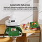 White heat press on a wooden table, displaying colorful printed T-shirts