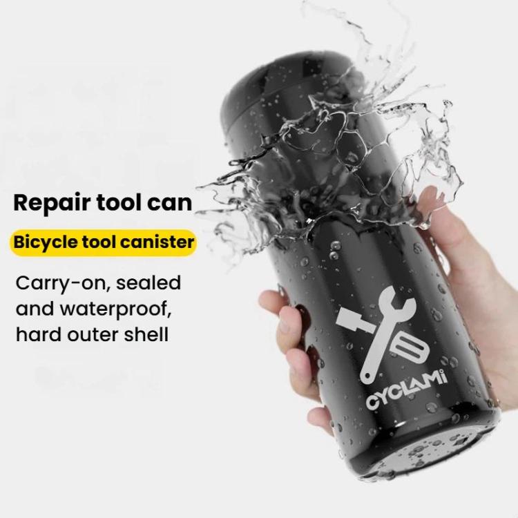 Black bottle-style bicycle repair tool can held in hand with water splashes
