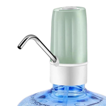 Green electric water dispenser with curved metal spout and white base over water bottle