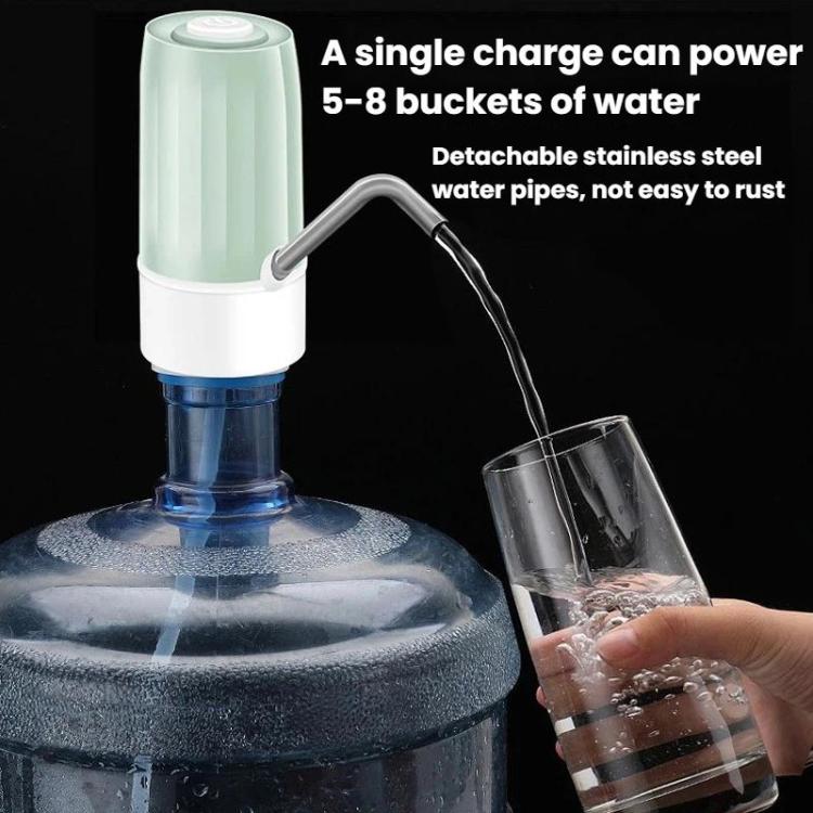 Mint green electric water dispenser dispensing water through metal spout