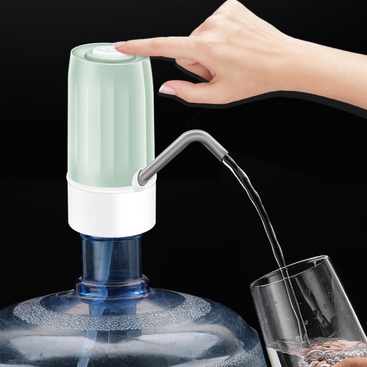 Mint green electric water dispenser with hands dispensing water into a cup