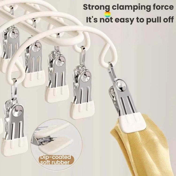 Close-up of white drying clips with stainless steel clamps and soft rubber grip