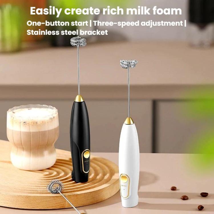Wireless handheld milk frothers (black and white) with whisk heads, near milk foam.