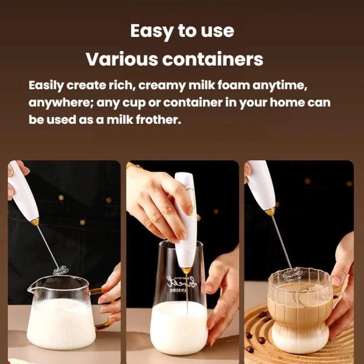 White handheld milk frother whisking milk in a cup, with extended mixing stem.