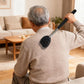 Portable back scratcher held against a person’s upper back with a black spiked head