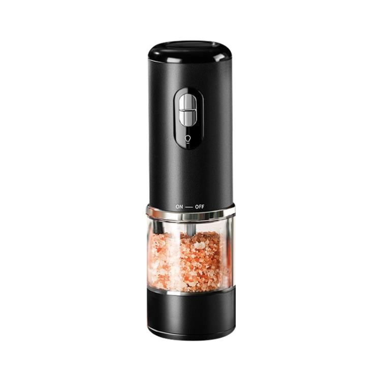 Black electric grinder with clear chamber holding red pepper crystals and a control switch