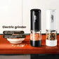 Electric salt and pepper grinder set: black and white units with clear ingredient chambers