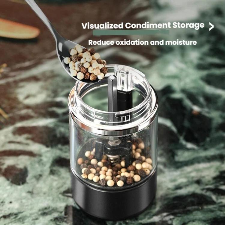 Clear condiment container with black electric grinder top, showing peppercorns inside
