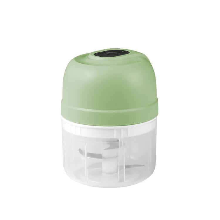 Rechargeable mini food chopper in light green with clear bowl and blade assembly