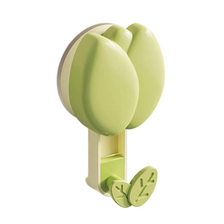 Green flower-shaped suction cup towel rack with two leaf hooks and storage base