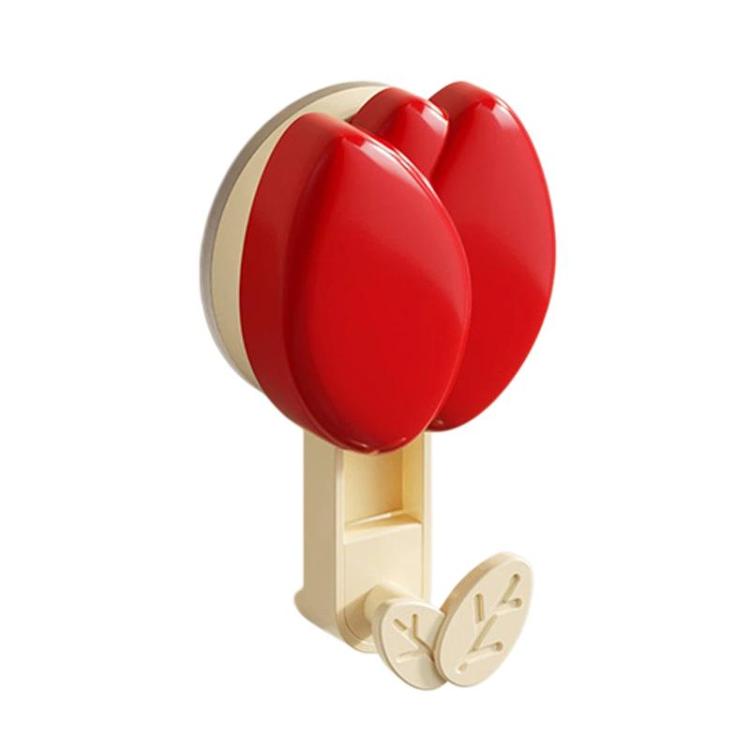 Red flower-shaped suction cup towel rack with two leaf hooks and beige mount base
