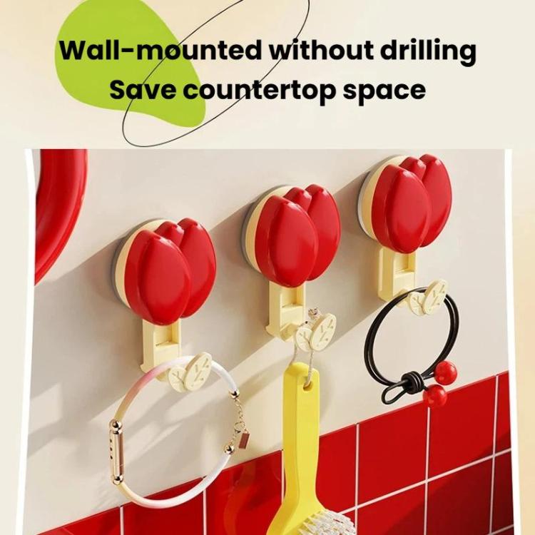 Multiple red flower suction cup towel racks mounted on a wall with leaf hooks