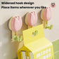 Pink flower suction cup towel rack with widened leaf hooks on a wall mount