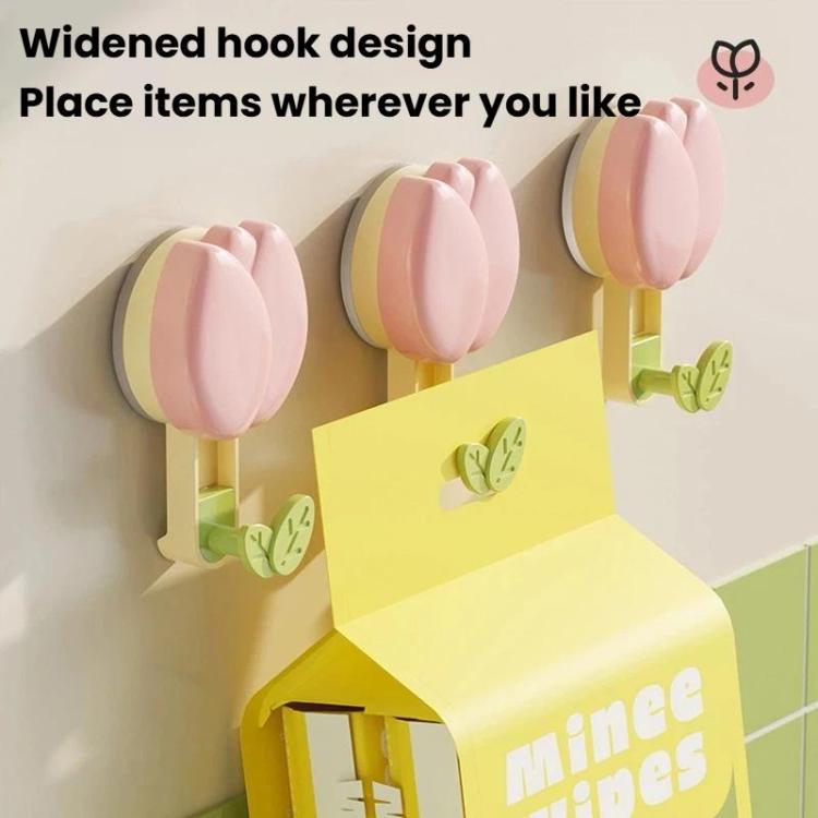 Pink flower suction cup towel rack with widened leaf hooks on a wall mount