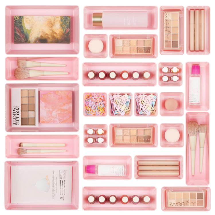 Pink makeup and stationery organizer set with multiple compartment trays and dividers